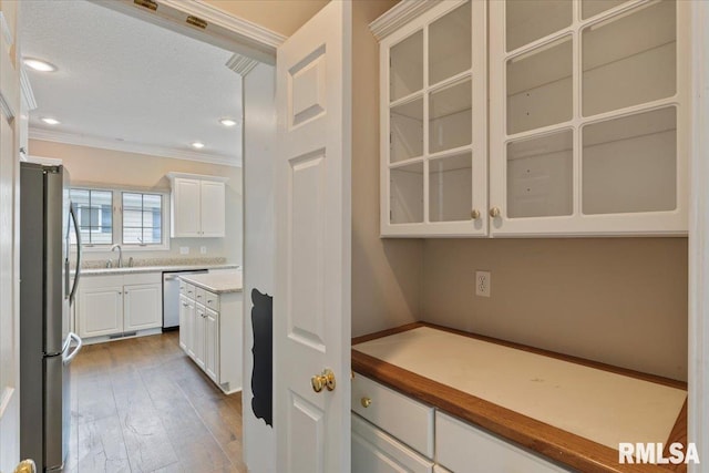 1 S Shore Ln, Rapids City, IL 61278 - kitchen featuring crown molding, stainless steel appliances, white cabinetry, hardwood / wood-style floors, and glass insert cabinets