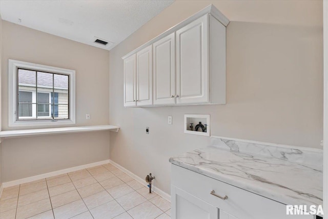 1 S Shore Ln, Rapids City, IL 61278 - laundry room with cabinet space, washer hookup, electric dryer hookup, and light tile patterned flooring