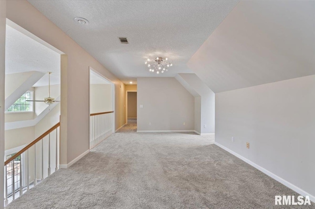 1 S Shore Ln, Rapids City, IL 61278 - bonus room with carpet, vaulted ceiling, a textured ceiling, ceiling fan, and a chandelier