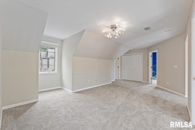1 S Shore Ln, Rapids City, IL 61278 - additional living space featuring carpet floors, lofted ceiling, and a textured ceiling