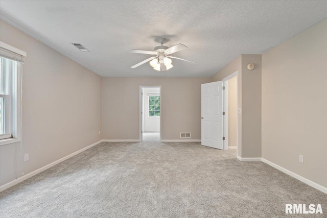 1 S Shore Ln, Rapids City, IL 61278 - unfurnished room with ceiling fan, carpet, and a textured ceiling
