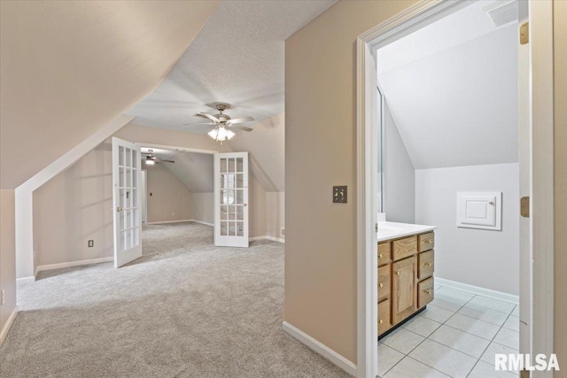 1 S Shore Ln, Rapids City, IL 61278 - additional living space featuring lofted ceiling, french doors, a ceiling fan, and light colored carpet