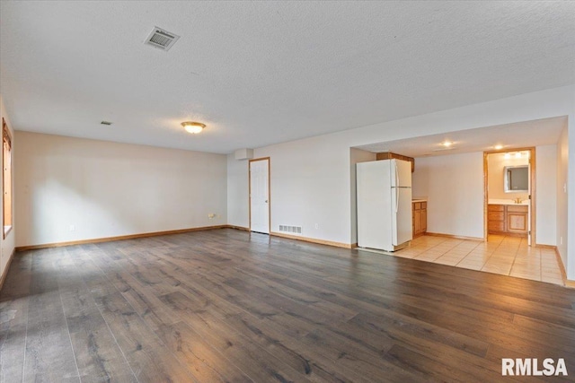 1 S Shore Ln, Rapids City, IL 61278 - empty room with light wood-style floors and a textured ceiling