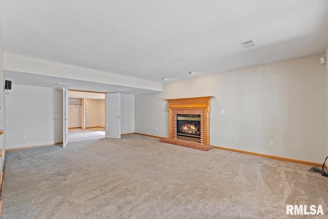 1 S Shore Ln, Rapids City, IL 61278 - unfurnished living room with carpet floors, a fireplace, and a textured ceiling