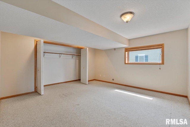 1 S Shore Ln, Rapids City, IL 61278 - unfurnished bedroom with light colored carpet, a textured ceiling, and a closet