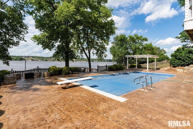 1 S Shore Ln, Rapids City, IL 61278 - view of swimming pool featuring a diving board, a water view, a pergola, and a patio area