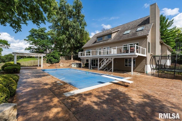 1 S Shore Ln, Rapids City, IL 61278 - swimming pool featuring a trampoline, stairs, a wooden deck, a pergola, and a patio area
