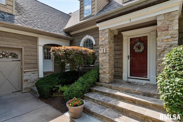 1 S Shore Ln, Rapids City, IL 61278 - doorway to property featuring a shingled roof, stone siding, and a garage