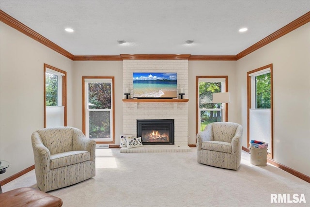 6470 James Rd, Bettendorf, IA 52722 - living room featuring a brick fireplace, carpet floors, crown molding, healthy amount of natural light, and recessed lighting