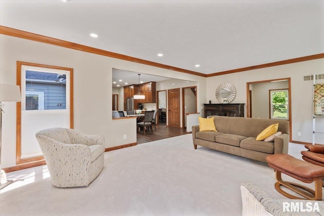 6470 James Rd, Bettendorf, IA 52722 - living area with crown molding, recessed lighting, dark carpet, and dark wood-style flooring