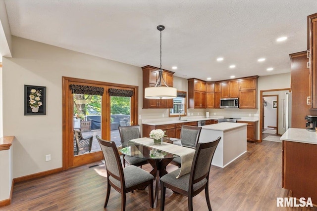 6470 James Rd, Bettendorf, IA 52722 - dining area featuring dark wood-style flooring and recessed lighting