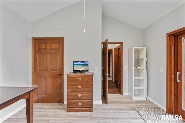 6470 James Rd, Bettendorf, IA 52722 - bedroom with light wood-type flooring and high vaulted ceiling