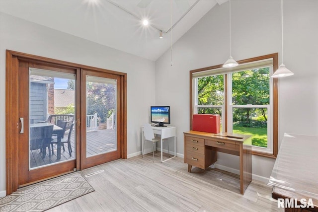 6470 James Rd, Bettendorf, IA 52722 - office area featuring vaulted ceiling, rail lighting, and light wood-style floors