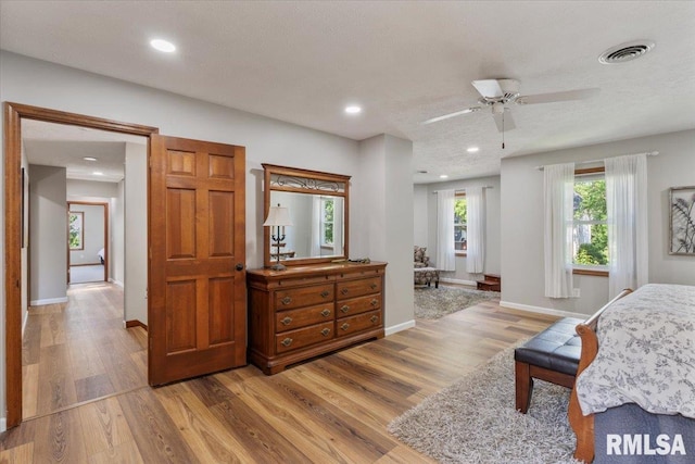 6470 James Rd, Bettendorf, IA 52722 - bedroom featuring wood finished floors and recessed lighting