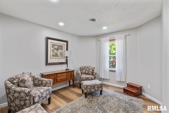 6470 James Rd, Bettendorf, IA 52722 - living area with light wood-style floors and recessed lighting