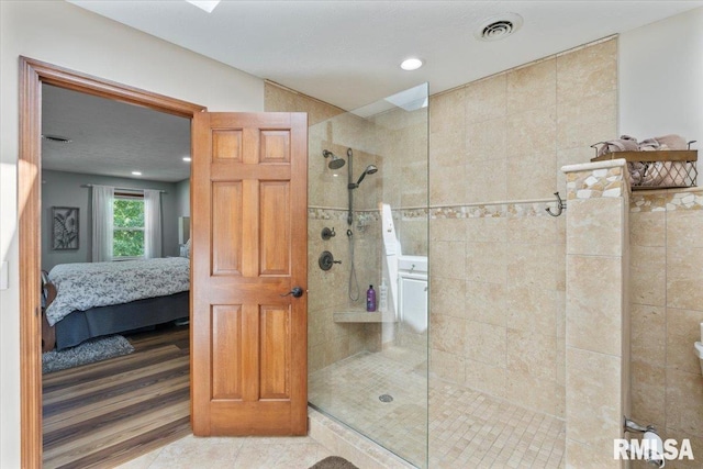 6470 James Rd, Bettendorf, IA 52722 - ensuite bathroom with a walk in shower, recessed lighting, and tile patterned floors