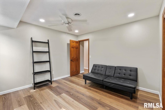6470 James Rd, Bettendorf, IA 52722 - living area with light wood-type flooring, ceiling fan, and recessed lighting