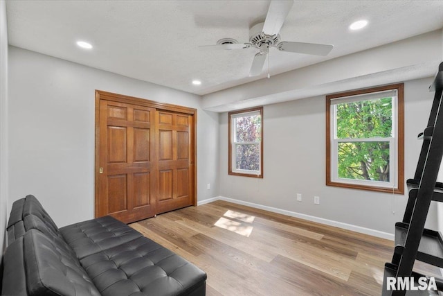 6470 James Rd, Bettendorf, IA 52722 - sitting room with a ceiling fan, light wood-style flooring, and recessed lighting