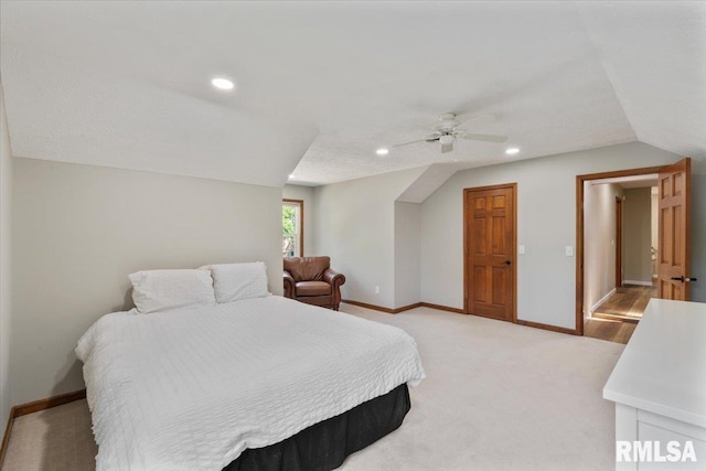 6470 James Rd, Bettendorf, IA 52722 - bedroom with lofted ceiling, ceiling fan, light colored carpet, and recessed lighting