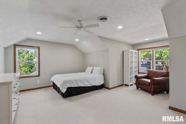6470 James Rd, Bettendorf, IA 52722 - bedroom with vaulted ceiling, a textured ceiling, light carpet, recessed lighting, and ceiling fan