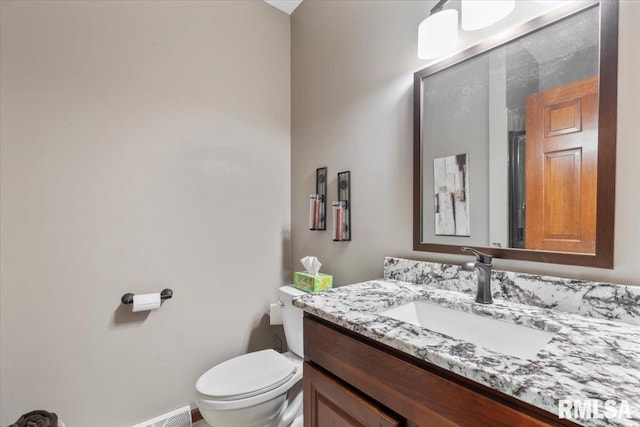 6470 James Rd, Bettendorf, IA 52722 - bathroom with toilet and vanity
