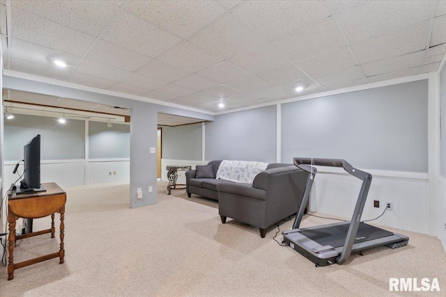 6470 James Rd, Bettendorf, IA 52722 - carpeted living room featuring wainscoting