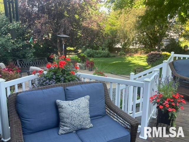 6470 James Rd, Bettendorf, IA 52722 - wooden terrace with a yard