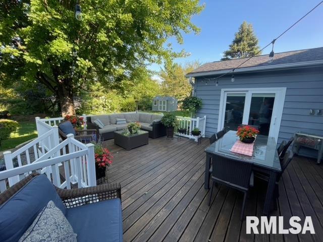 6470 James Rd, Bettendorf, IA 52722 - wooden deck with an outdoor living space