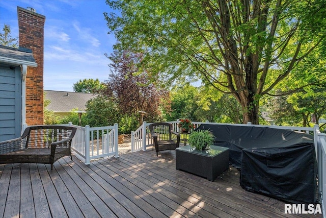 6470 James Rd, Bettendorf, IA 52722 - wooden terrace featuring outdoor lounge area