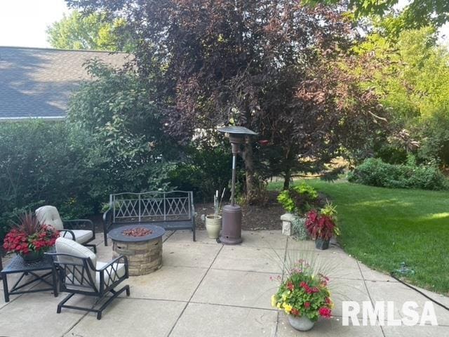 6470 James Rd, Bettendorf, IA 52722 - view of patio with an outdoor fire pit