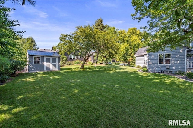 6470 James Rd, Bettendorf, IA 52722 - view of grassy yard with a storage unit