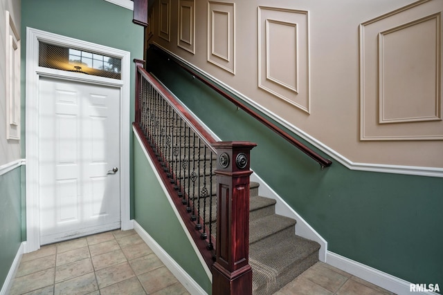 2997 3rd St Unit 206, Moline, IL 61265 - stairs with baseboards and tile patterned flooring