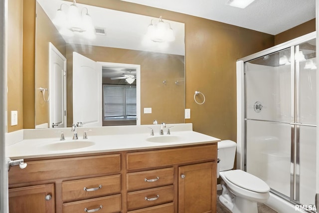 2997 3rd St Unit 206, Moline, IL 61265 - bathroom featuring double vanity, a shower stall, and a ceiling fan