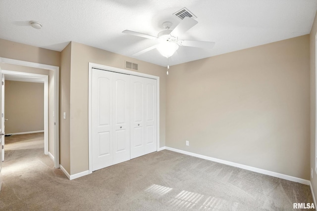 2997 3rd St Unit 206, Moline, IL 61265 - unfurnished bedroom with carpet, a closet, and ceiling fan