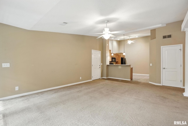2997 3rd St Unit 206, Moline, IL 61265 - unfurnished living room featuring a ceiling fan and light colored carpet
