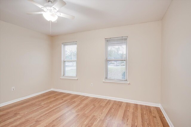 unfurnished room with ceiling fan and light hardwood / wood-style floors