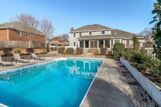 view of swimming pool with a patio