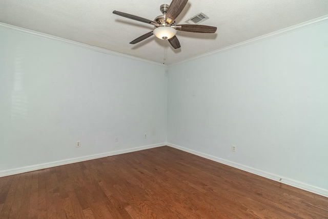 empty room featuring ceiling fan, hardwood / wood-style floors, and crown molding