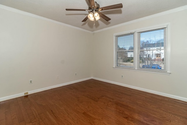 spare room with ceiling fan, dark hardwood / wood-style floors, and crown molding