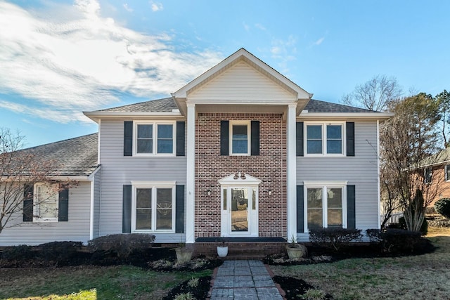 view of front of house with a front lawn