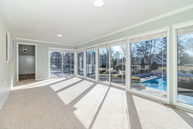 unfurnished sunroom featuring an inviting chandelier