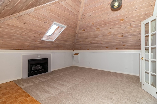 bonus room featuring wooden ceiling and lofted ceiling with skylight