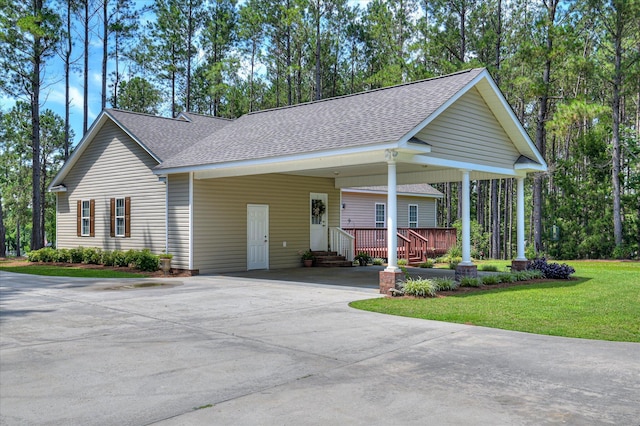 116 Barrett Mill Rd, Waynesboro, GA 30830 - view of front of house with roof with shingles, driveway, a front lawn, an attached carport, and entry steps