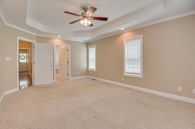 116 Barrett Mill Rd, Waynesboro, GA 30830 - unfurnished bedroom featuring a raised ceiling, ornamental molding, light carpet, recessed lighting, and ensuite bath