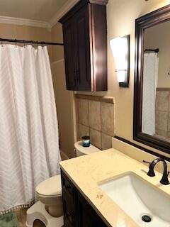 4614 Stoneridge Ct, Evans, GA 30809 - bathroom featuring toilet, vanity, ornamental molding, and curtained shower