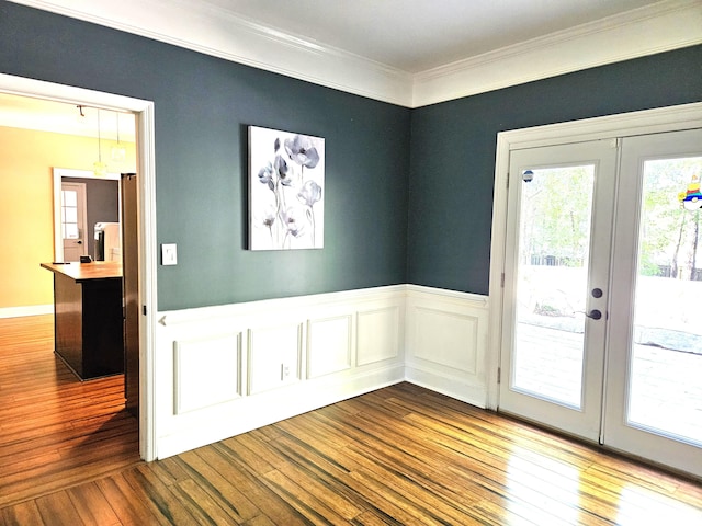 4614 Stoneridge Ct, Evans, GA 30809 - empty room with dark wood-style floors, french doors, ornamental molding, and wainscoting