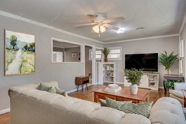 living area featuring ornamental molding, ceiling fan, and wood finished floors