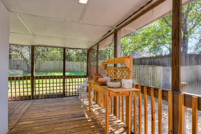 deck with a fenced backyard