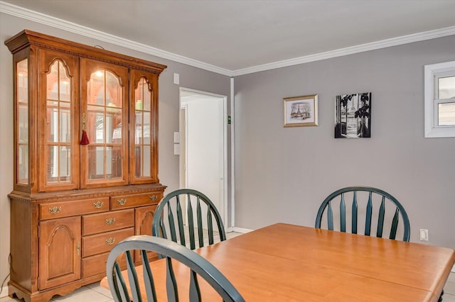 dining room featuring ornamental molding