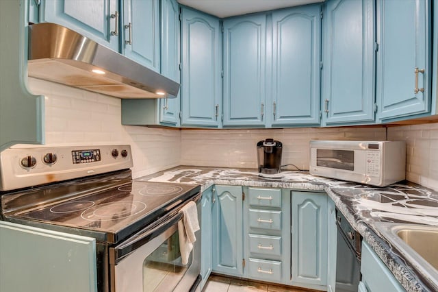 kitchen with electric range, blue cabinetry, and under cabinet range hood